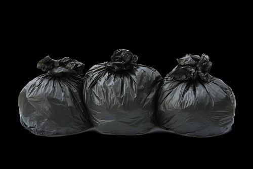 Licensed waste removal vehicle servicing a London business property