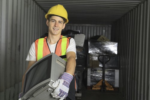 Worker preparing a London garden for clearing and disposal